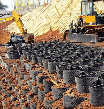Retaining wall reinforced with geocells to improve structural stability and soil retention