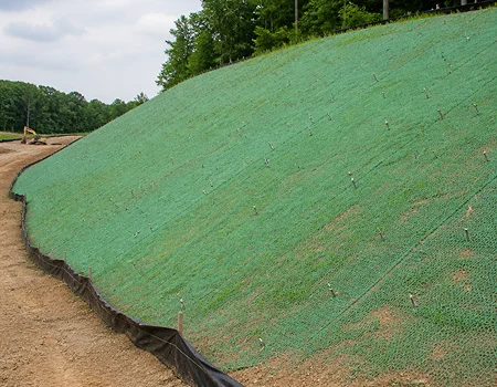 Erosion control mat installed to protect soil from erosion and improve long-term slope stability