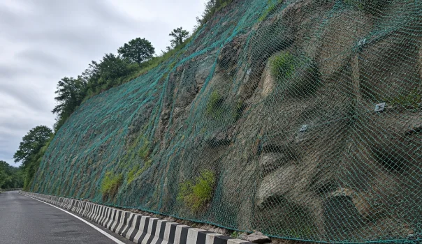 Rockfall protection system safeguarding roads and infrastructure from falling rock hazards