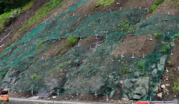 Geosynthetic slope protection system designed to minimize excessive soil erosion